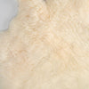 Soft, thick, & supportive British economy sheepskin pet bed or economical rug for the home or garden in natural creamy tones