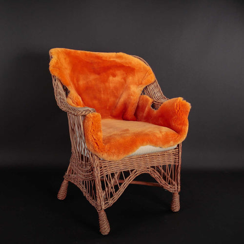 Soft, luxurious sheepskin throw in mandarin orange would look fabulous in any interior shorn fleece From The Wool Company