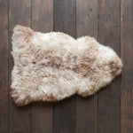 Subtle flecks of coffee browns running through a light-coloured creamy fleece. Soft and silky genuine British sheepskin.