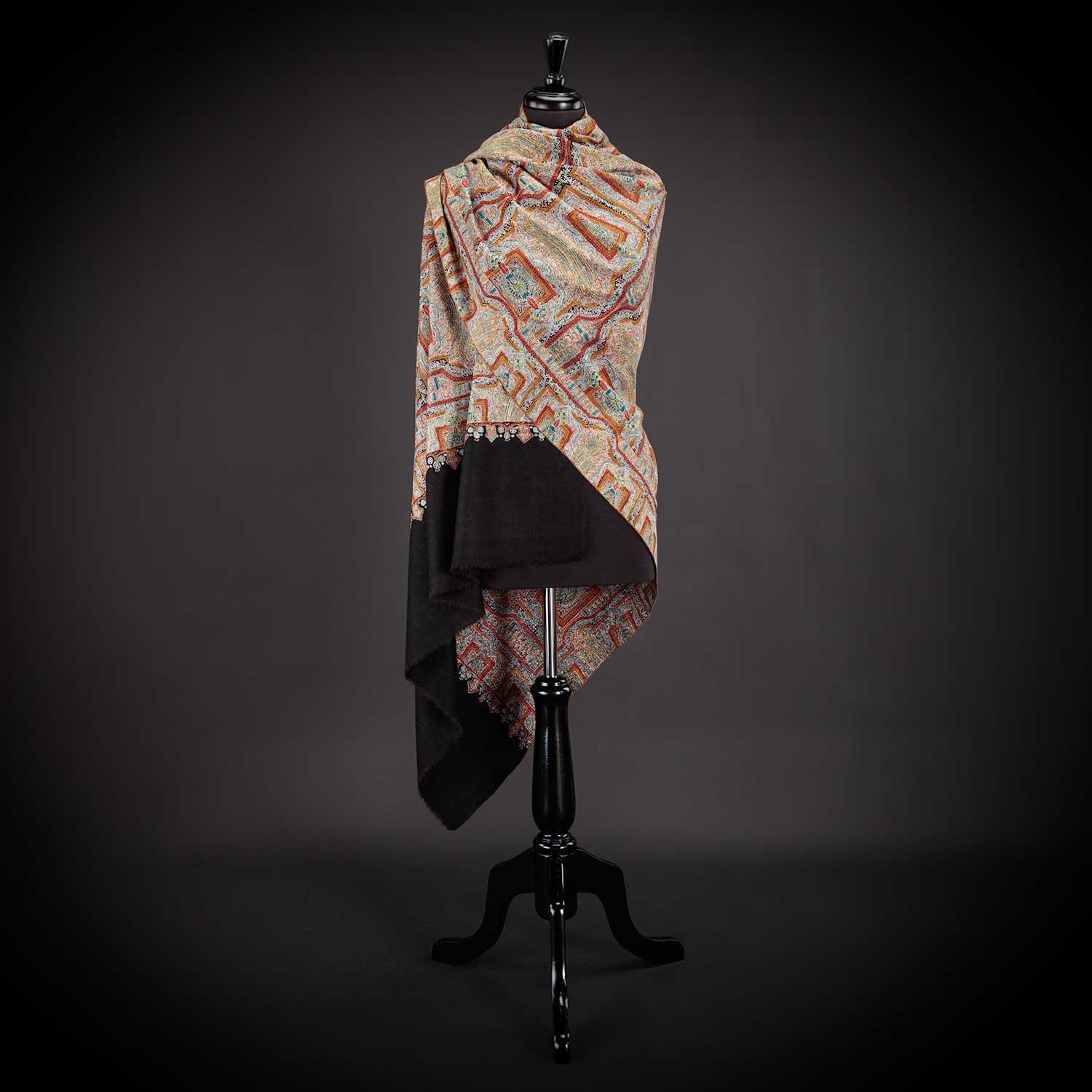 This cashmere pashmina is a perfectly beautiful example of handwoven and hand-embroidered craftsmanship from Kashmir. The design is inspired by Mandala Geometry and mandals worn by Buddhist monks. Size: 199 x 103 CMS, 351 Grams.