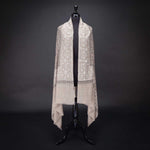 Hand-crafted 100% baby cashmere pashmina embroidered with black & white thread on a neutral background finest-quality