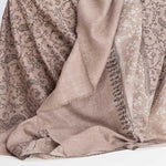 Hand-crafted 100% baby cashmere pashmina embroidered with black & white thread on a neutral background finest-quality