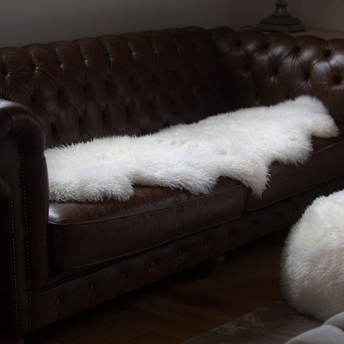 Beautifully soft long curly natural ivory sheepskin. Double size boho-chic accessory for any interior. From The Wool Company