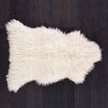 Beautifully soft long curly natural ivory sheepskin. A stunning boho-chic accessory for any interior. From The Wool Company