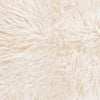 Beautifully soft long curly wool natural ivory Yeti sheepskin. A stunning boho-chic accessory for any interior. 