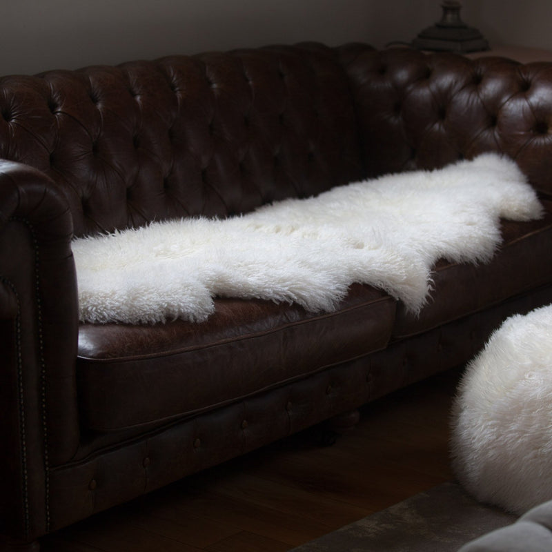 Beautifully soft long curly wool natural ivory Yeti sheepskin. A stunning boho-chic accessory for any interior. 