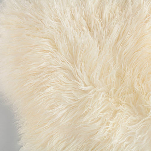 Beautifully soft long curly wool natural ivory Yeti sheepskin. A stunning boho-chic accessory for any interior. 