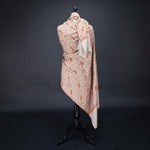 Hand-crafted 100% baby cashmere pashmina embroidered with orange red & gold thread on a neutral background finest-quality