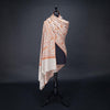 Hand-crafted 100% baby cashmere pashmina embroidered with orange red & gold thread on neutral background By The Wool Company