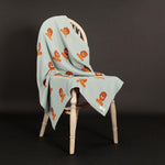 Soft blue-green 100% cotton baby blanket with cute Lenny lion characters in tan & orange perfect for all seasons top-quality