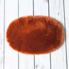 Silky soft, thick, & supportive luxury shorn dyed small sheepskin oval pet bed in attractive colours for a cat or small dog