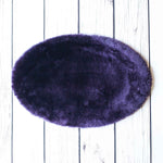 Silky soft, thick, & supportive luxury shorn dyed small sheepskin oval pet bed in attractive colours for a cat or small dog