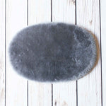 Silky soft, thick, & supportive luxury shorn dyed small sheepskin oval pet bed in attractive colours From The Wool Company