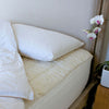 Reversible mattress topper, Merino wool pile & luxurious lambswool filling.  high-quality cotton cover By The Wool Company