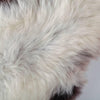 Luxurious, thick long white fleece, strikingly outlined with black and/or dark brown around the edges. Quality British hide.