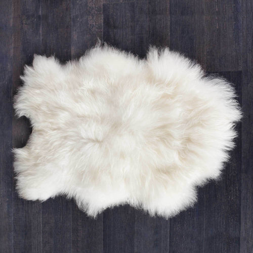 Beautiful natural white undyed sheepskins with very fine, soft, and silky long wool. Each one is unique From The Wool Company