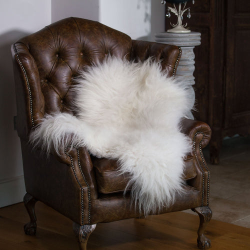 Beautiful natural white undyed sheepskins with very fine, soft, and silky long wool. Each one is unique and a real statement.