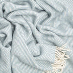 100% pure new wool British-made throw in a soft duck egg blue, fishbone pattern top-quality contemporary subtle colourway