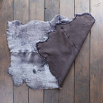 Quad-size sheepskin throw in shades of grey, silver, and charcoal extremely soft & silky, beautifully finished stunning piece