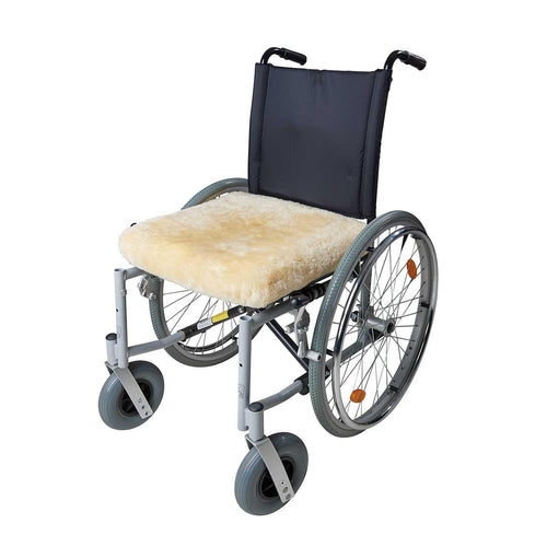 Natural creamy colour lambskin wheelchair cushion providing all-year-round comfort & support  By The Wool Company
