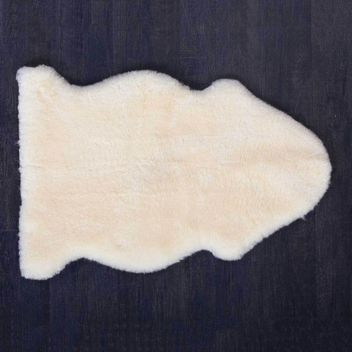 Pale golden lambskin for babies. Soft with a short, thick, dense fleece, undyed and unbleached. From The Wool Company