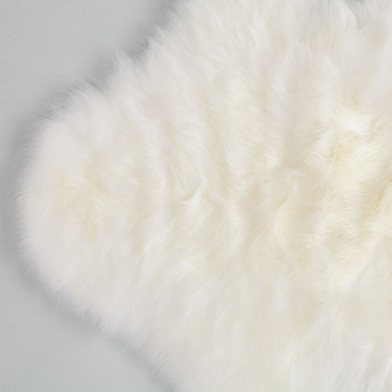 Extremely soft, luxurious, & beautiful to touch ivory white baby sheepskin, carefully selected for a naturally short fleece 