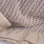 British-made pure new wool cellular weave blankets warmth without weight traditional wide satin-style ribbon trim 